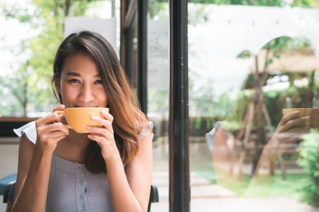 Japanese girl enjoying coffee